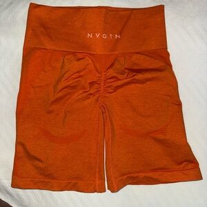 NVGTN Sunset Orange Scrunch Seamless Shorts